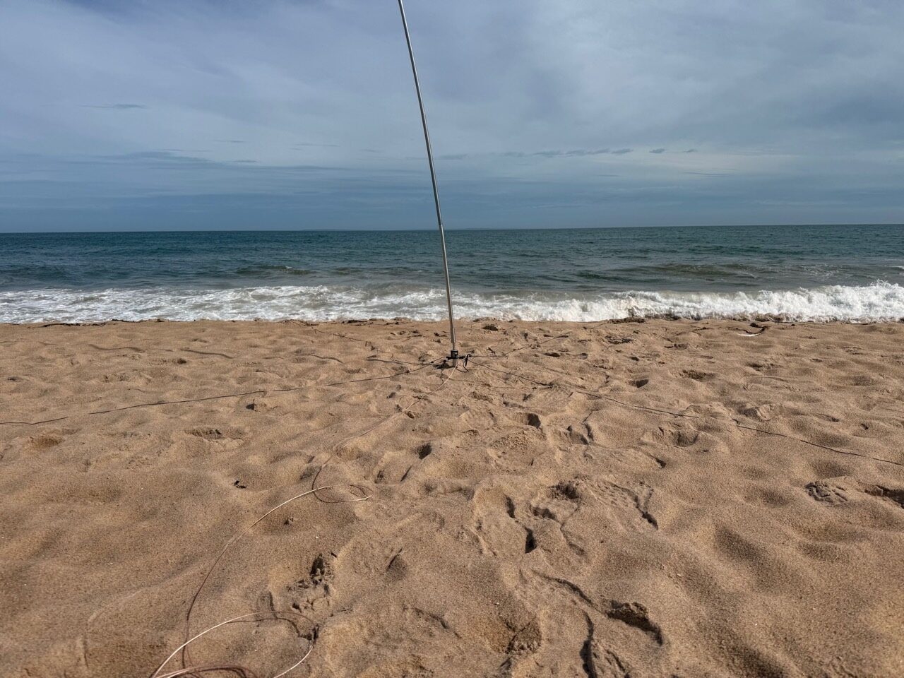 REZ 25-foot whip in the sand near the shoreline at East State Beach