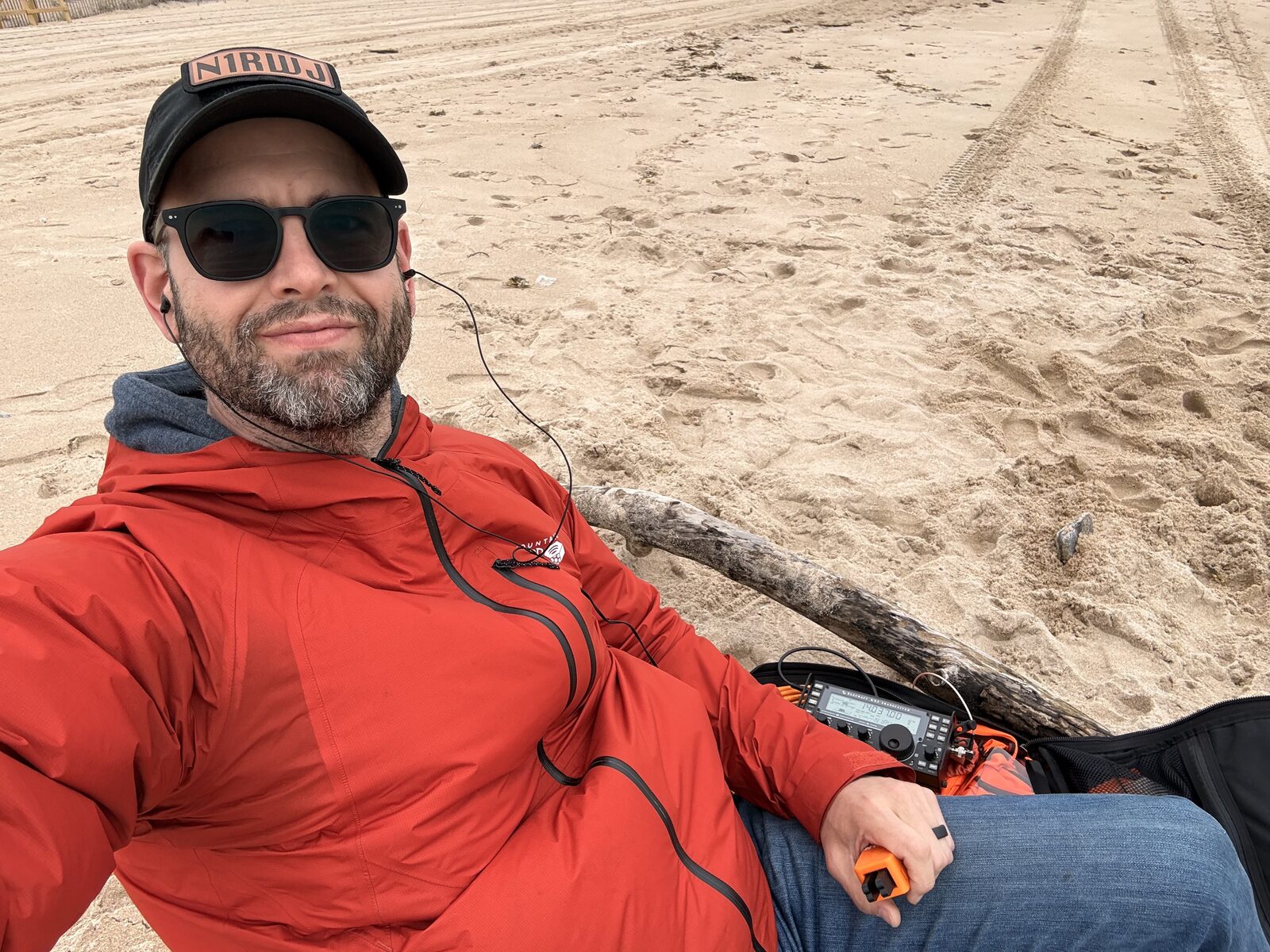 Operator seated on the sand with the REZ Scout setup at Misquamicut State Beach
