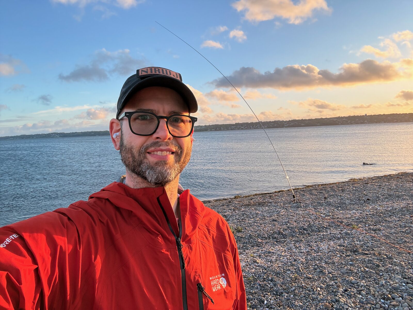 Operator selfie at Sapowet Marsh with the whip set up by the shoreline at sunset