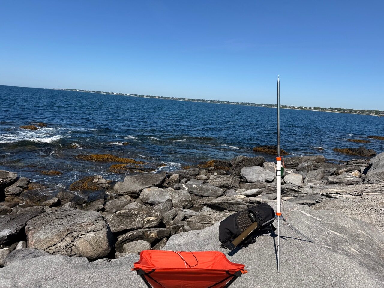KJ6ER Challenger whip on a mini tripod at the rocky Sachuest Point shoreline