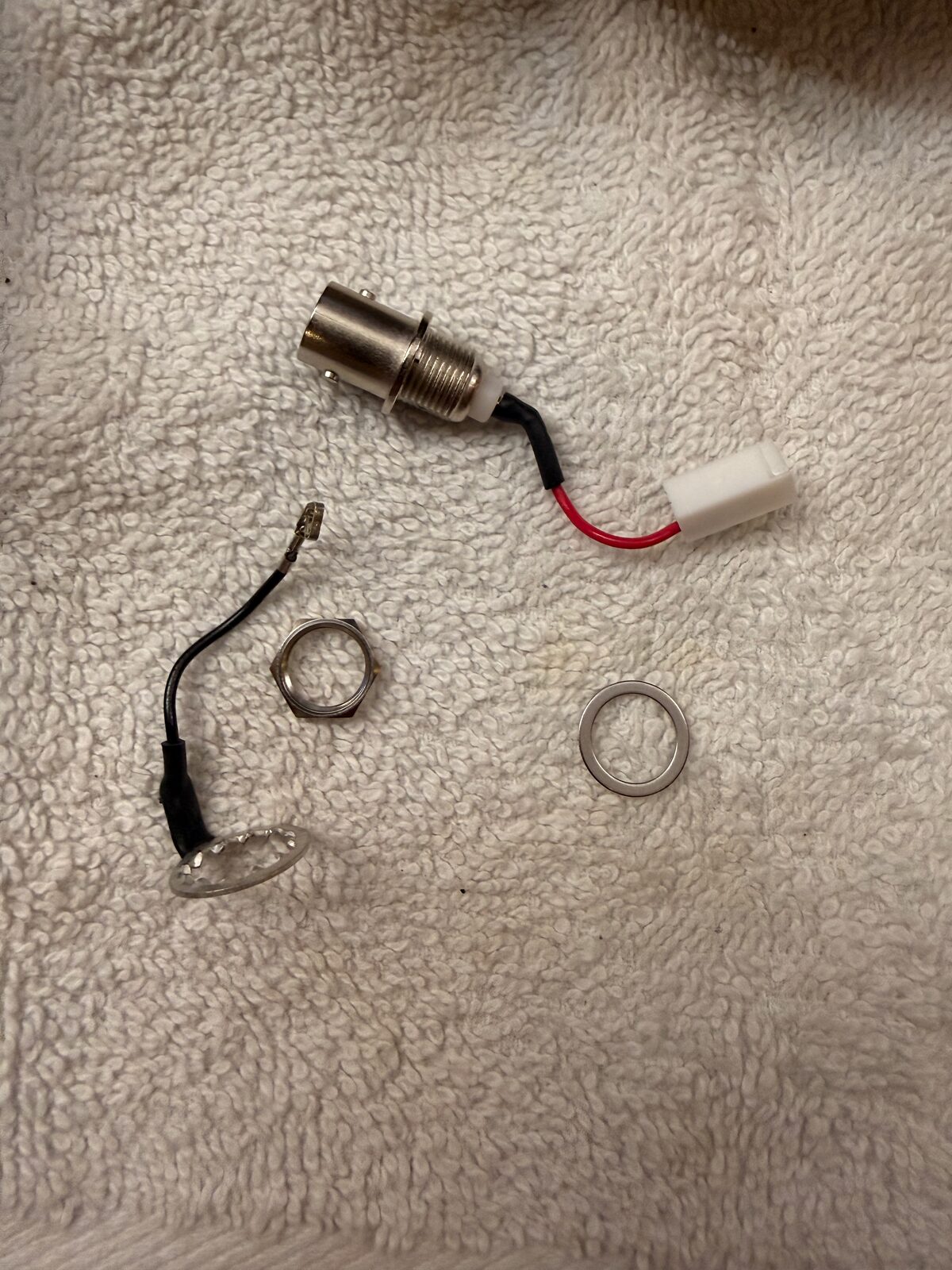 Small parts removed from the KX2 side plate during the install