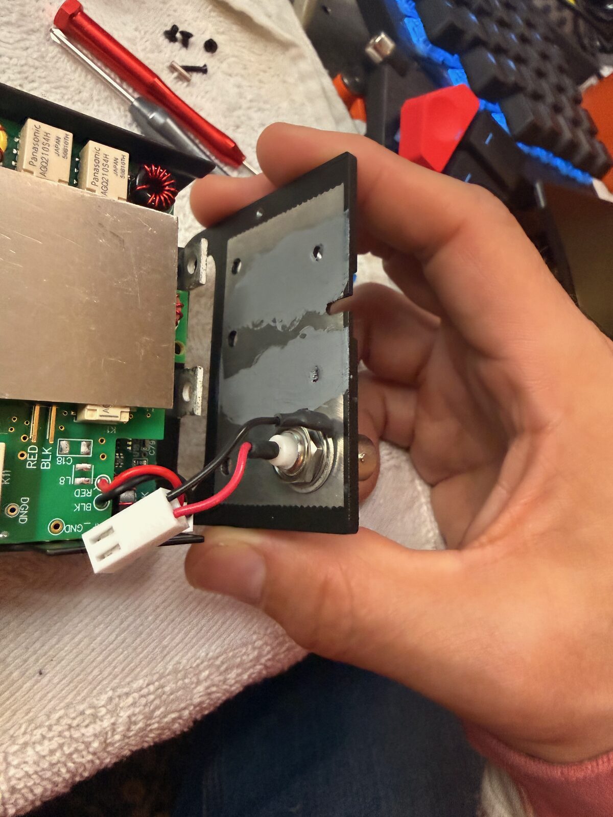 Replacement side plate being fitted back onto the KX2