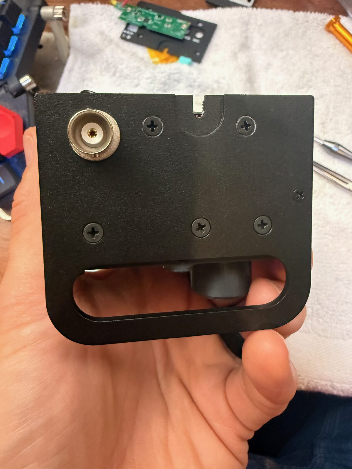 Side KX rail plate held next to the KX2 during test fitting