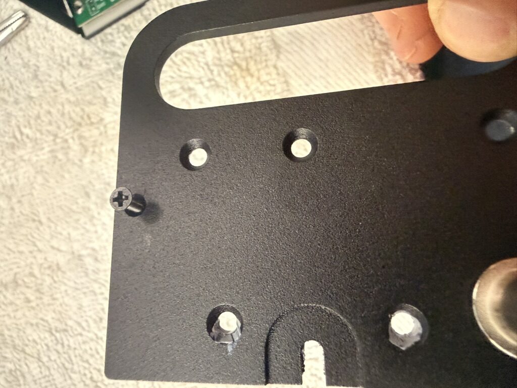 Outside of the KX2 side rail showing the screw threading into the standoff